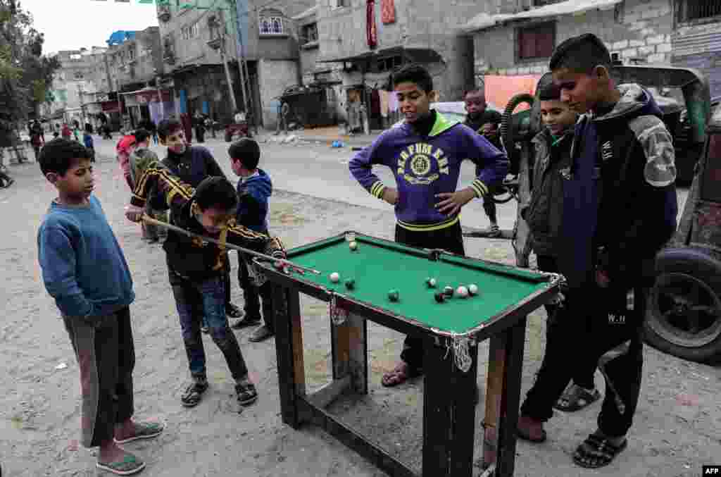 Palestinian boys play pool in the Rafah refugee camp in the southern Gaza Strip.