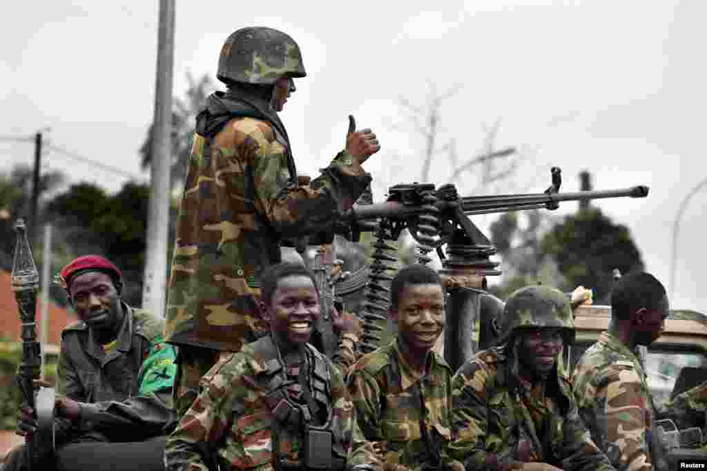 Seleka soldiers sit in a pick-up truck in Bangui, Central African Republic, Dec. 6, 2013.