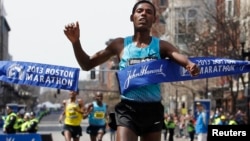 Lelisa Desisa Benti of Ethiopia crosses the finish line to win the men's division of the 117th Boston Marathon in Boston, Massachusetts April 15, 2013.