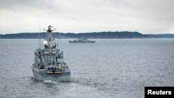 Swedish minesweeper HMS Kullen patrols the Stockholm Archipelago Oct. 19, 2014, searching for what the military says could be a foreign underwater threat.