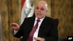 Iraq's Prime Minister Haider al-Abadi speaks during an interview with The Associated Press in Baghdad, Iraq, Sept. 16, 2017. 