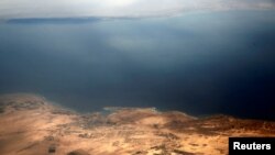 FILE - An aerial view of the coast of the Red Sea and the two islands of Tiran and Sanafir is pictured through the window of an airplane near Sharm el-Sheikh, Egypt Nov. 1, 2016. 