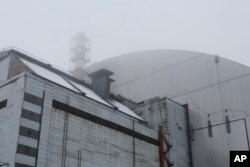 A view of the new shelter installed over the the exploded reactor at the Chernobyl nuclear plant in Chernobyl, Ukraine, Dec. 22, 2016.