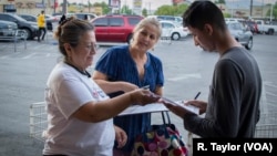 A volunteer helps to register eligible voters in Las Vegas, Nevada, ahead of the November midterm election.