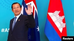 Cambodia's Prime Minister Hun Sen reacts to a journalist's question as he walks with Australian Prime Minister Malcolm Turnbull before the start of their bilateral meeting during the one-off summit of 10-member Association of Southeast Asian Nations (ASEA).