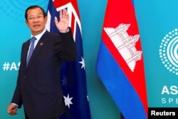 Cambodia's Prime Minister Hun Sen reacts to a journalist's question as he walks with Australian Prime Minister Malcolm Turnbull before the start of their bilateral meeting during the one-off summit of 10-member Association of Southeast Asian Nations (ASEAN) in Sydney, Australia, March 16, 2018.