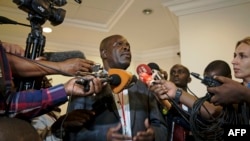 FILE — Ugandan government spokesman Ofwono Opondo speaks to journalists on November 11, 2013 at State House in Entebbe.