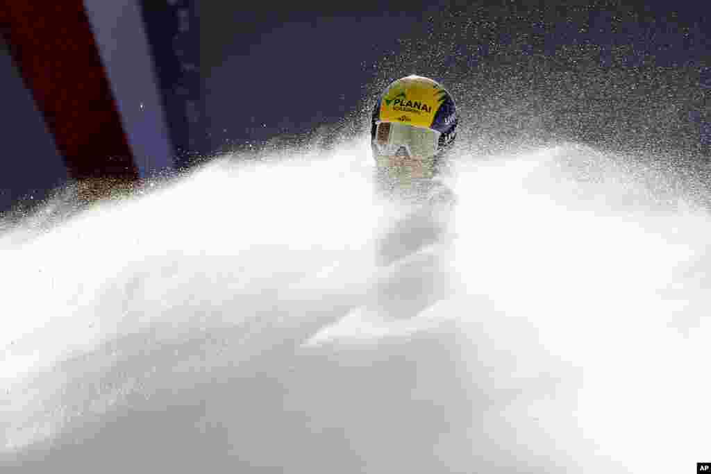 Austria's Tamara Tippler is covered in snow as she gets to the finish line after completing an alpine ski, women's World Cup downhill, in Val d'Isere, France.