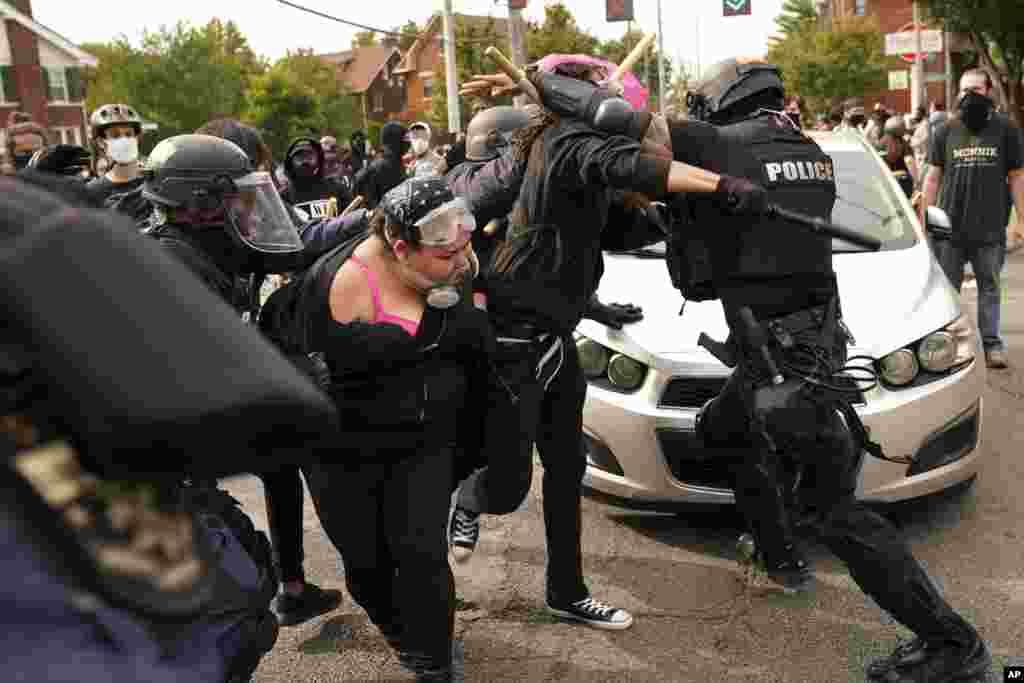 Police and protesters clash on September 23, 2020 in Louisville, Kentucky after a grand jury charged one officer on criminal charges six months after Breonna Taylor was shot and killed by police in Kentucky.&nbsp;