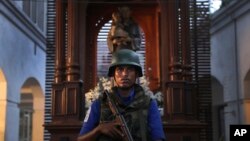 A Sri Lankan soldier stands guard at the damaged St. Anthony's Church or Shrine in Colombo, Sri Lanka, April 26, 2019.