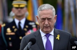 FILE - Defense Secretary Jim Mattis speaks during a ceremony at the Pentagon in Washington, Sept. 21, 2018.