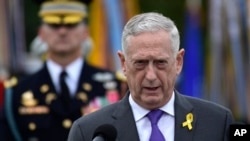 FILE - Defense Secretary Jim Mattis speaks during the 2018 POW/MIA National Recognition Day Ceremony at the Pentagon in Washington, Sept. 21, 2018.