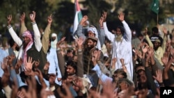Supporters of the Pakistan Defense Council chant slogans at a rally against America, in Rawalpindi, Pakistan, Dec. 29, 2017. The Palestinian envoy attended the rally with Hafiz Saeed, the head of the hard-line Jamaat-ud-Dawa movement and a suspected terrorist. The envoy was later recalled.
