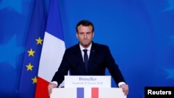 FILE - French President Emmanuel Macron addresses a news conference during European Union leaders informal summit in Brussels, Belgium, Feb. 23, 2018.