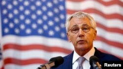 U.S. Defense Secretary Chuck Hagel addresses a joint media briefing with Romania's Defense Minister Mircea Dusa (not pictured) in the Black Sea port of Constanta June 5, 2014.