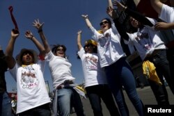 Youths dance outside Guadalupe's basilica while waiting for the arrival of Pope Francis in Mexico City, Feb. 13, 2016.