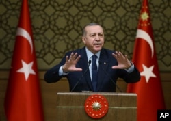 Turkey's President Recep Tayyip Erdogan addresses local administrators in Ankara, Turkey, Feb. 8, 2018. Turkish officials say the leaders of Turkey, Russia and Iran will meet in Istanbul to discuss peace efforts for Syria.