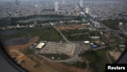 FILE - The cleaning operation of the area that was used for storing Agent Orange is seen from a plane taking off from Danang international airport.