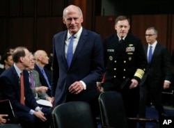 From left, National Intelligence Director Dan Coats, National Security Agency director Adm. Michael Rogers and acting FBI Director Andrew McCabe, arrive for the Senate Intelligence Committee hearing about the Foreign Intelligence Surveillance Act, on Capitol Hill.