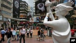 A statue of the Goddess of Democracy, which symbolizes the 1989 pro-democracy movement in Beijing, is displayed at a downtown street in Hong Kong, June 3, 2014, to mark the 25th anniversary of China's bloody crackdown on Tiananmen Square on June 4. 