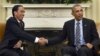 President Barack Obama shake hands with Indonesian President Joko Widodo during their meeting in the Oval Office of the White House in Washington, Oct. 26, 2015.