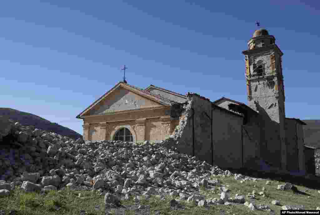 The tower of the Church of the Madonna of the Angels (Madonna degli Angeli) is still standing amidst rubble near Norcia, central Italy, after the earthquake, Oct. 30, 2016.