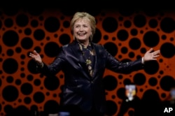 Former Secretary of State Hillary Clinton gestures while speaking before the Professional Businesswomen of California, March 28, 2017, in San Francisco.