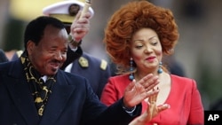 Cameroon's President Paul Biya and First Lady Chantal Biya arrive at the opening ceremony of the Francophone Summit in Montreux, Switzerland, October 23, 2010.