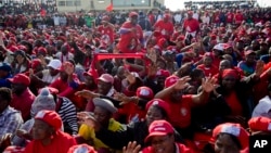 FILE: Thousands of opposition party supporters cheer leading opposition challenger Nelson Chamisa during a campaign rally in Bulawayo, Zimbabwe, Saturday July 21, 2018. 
