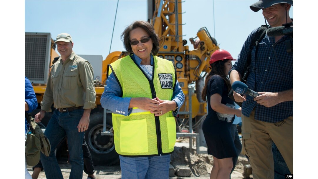 FILE - Cape Town Mayor Patricia de Lille talks at a site where the city council has ordered drilling into the aquifer to tap water in Mitchells Plain, about 25km from the city center, Jan. 11, 2018, Cape Town.