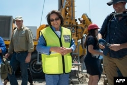 Cape Town City Mayor Patricia de Lille talks at a site where the city council has ordered drilling into the aquifer to tap water in Mitchells Plain, about 25km from the city center on January 11, 2018 in Cape Town.