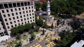 A sign painted by protesters stating 