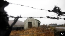 FILE - The old disused border post on the border between the Republic of Ireland and Northern Ireland near Jonesborough, Northern Ireland, Jan. 30, 2017.