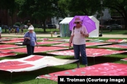 The Monument Quilt was envisioned and organized by FORCE: Upsetting Rape Culture. The Baltimore-based activist collaboration produces large-scale public art projects to generate media attention and get millions of people talking.