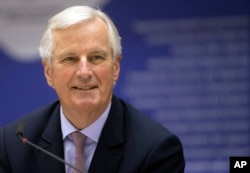 EU chief negotiator Michel Barnier smiles during a meeting in Brussels, March 22, 2017.