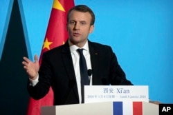 French President Emmanuel Macron delivers a speech at the Daming Palace in Xi'an in northwestern China's Shaanxi province, Monday, Jan. 8, 2018.