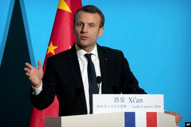 French President Emmanuel Macron delivers a speech at the Daming Palace in Xi'an in northwestern China's Shaanxi province, Monday, Jan. 8, 2018.