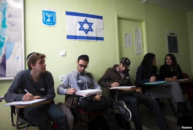 FILE - Newly arrived immigrants from France, all of whom are from Paris, study Hebrew at Ulpan Etzion, the original residential school and absorption center, in Jerusalem, Jan. 20, 2015.