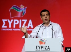 FILE - Greek Prime Minister Alexis Tsipras addresses a meeting of his ruling radical left Syriza party's central committee in Athens, July 30, 2015.