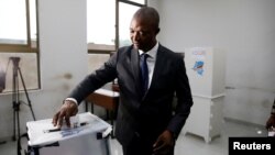 Emmanuel Ramazani Shadary, former Congolese Interior minister and presidential candidate, casts his vote at a polling station in Kinshasa, Democratic Republic of Congo, Dec. 30, 2018.