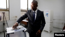 Emmanuel Ramazani Shadary, former Congolese Interior minister and presidential candidate, casts his vote at a polling station in Kinshasa, Democratic Republic of Congo, Dec. 30, 2018.