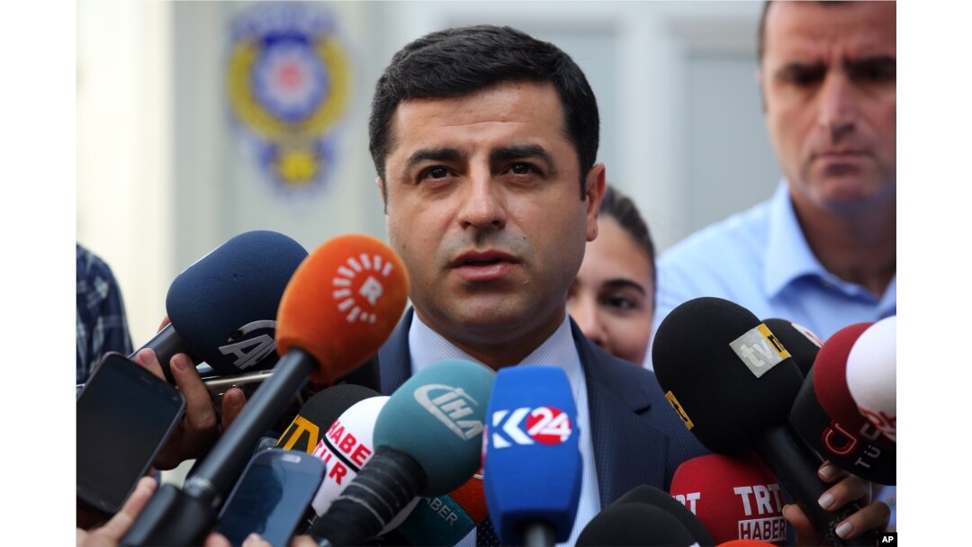 FILE - Pro-Kurdish Peoples' Democracy Party leader Selahattin Demirtas speaks to the media about Turkey's airstrikes against Kurdish rebel bases in Iraq, in Ankara, Turkey, July 27, 2015.
