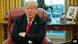 FILE - President Donald Trump speaks during a meeting in the Oval Office of the White House in Washington, Oct. 10, 2018.