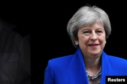 Britain's Prime Minister Theresa May leaves 10 Downing Street in London, Britain, June 20, 2018.