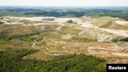An aerial view of the Hobet mine shows some of the greener areas in reclamation and gray areas more recently mined, in Boone County, West Virginia, May 12, 2016.