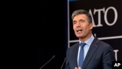 FILE - NATO Secretary-General Anders Fogh Rasmussen speaks during a media conference at NATO headquarters in Brussels, June 25, 2014.