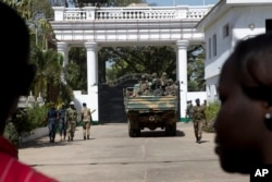 Senegalese troops enter the State House in Banjul, Gambia, Jan. 23, 2017, two days after Gambia's defeated leader Yahya Jammeh left the country.