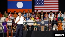 Participants listen as U.S. President Barack Obama holds a town hall-style meeting with a group of Young Southeast Asian Leaders Initiative (YSEALI) attendees, alongside his participation in the ASEAN Summit, at Souphanouvong University in Luang Prabang, 