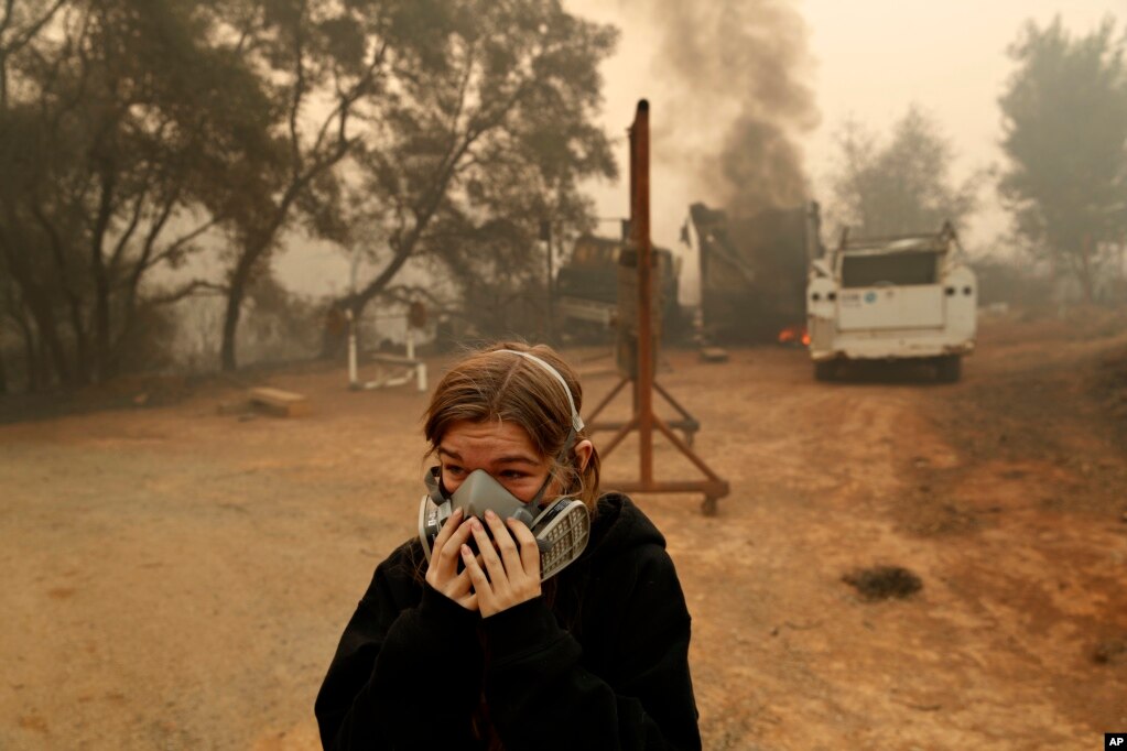 Araya Cipollini cries near the remains of her family's home burned in the Camp Fire, in Paradise, Calif., Nov. 10, 2018.