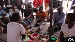 Village loan savings is also part of the EU-funded initiative in Zomba. Members of the initiative are demonstrating how savings are best achieved and managed. (L. Masina/VOA)